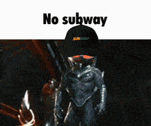 a man wearing a black subway hat stands in front of a dark background