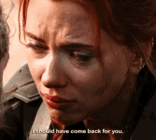 a close up of a woman 's face with the words `` i should have come back for you '' written on the bottom .