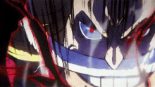 a close up of a man 's face with red eyes