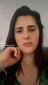a woman 's face is shown with a tik tok watermark
