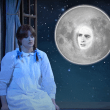 a woman in a white dress sits in front of a full moon with a face on it