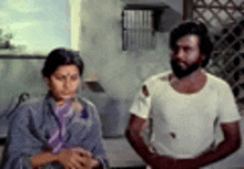 a man and a woman are standing next to each other and talking .