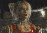 harley quinn from birds of prey is holding a drink in her hand and says `` have the best '' .