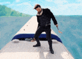 a man is standing on the roof of a boat holding a sword