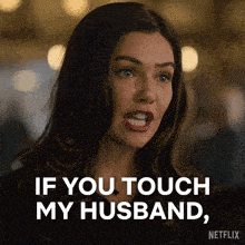a woman says if you touch my husband