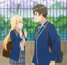 a boy and a girl standing next to each other