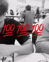 a black and white photo of people in a cafeteria with the number 100 written in red