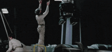 a man standing in front of a rocket that says fgs