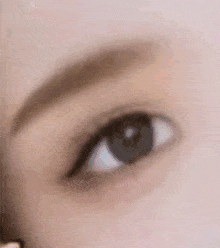 a close up of a woman 's eye with eyeliner