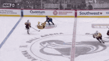 a hockey game is being played in the ball arena