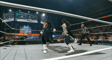 two wrestlers are in a ring with a sign that says double nothing