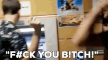 a man says " f # ck you bitch " while another man looks on