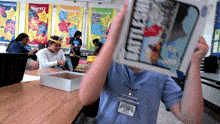 a person holding up a book that says " beatles " on it