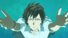 a man with glasses and a white shirt is swimming in the water with his arms outstretched