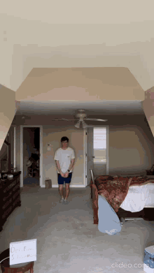 a man stands in a bedroom with a sign that says do n't foam on it