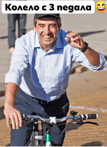 a man is smiling while riding a bike with the words kolelo c 3 negala on the bottom