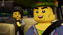 a man and a woman are sitting in a car and the man is smiling