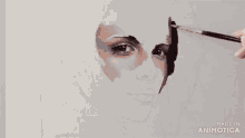 a painting of a woman 's face is being made in animotica