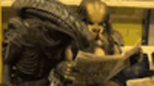 alien predator reading newspaper stop