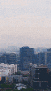 an aerial view of a city with lots of buildings