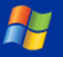 a blurry picture of the windows logo on a dark blue background