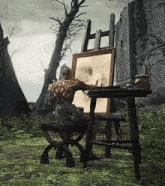 a statue of a man sitting at an easel painting a picture