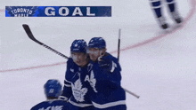 the toronto maple leafs hockey team celebrates a goal against the new york rangers