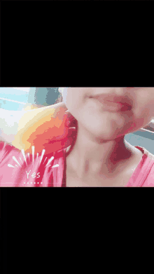 a close up of a girl 's face with the word yes visible