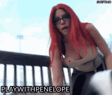 a woman with red hair is wearing glasses and a plunging neckline and the words play with penelope are above her