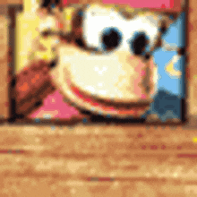 a picture of donkey kong on a wooden table with a blurred background .