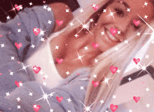 a woman is surrounded by hearts and stars and is smiling
