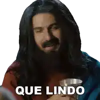 a man with long hair and a beard is holding a cup with que lindo written below him