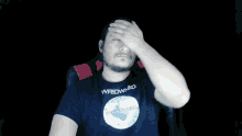 a man wearing a t-shirt that says " wasdwn " on it