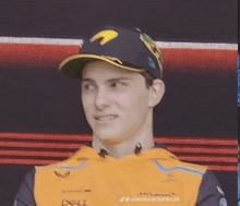 a close up of a man wearing a hat and a yellow shirt