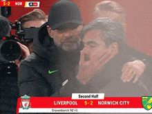a soccer game between liverpool and norwich city is shown
