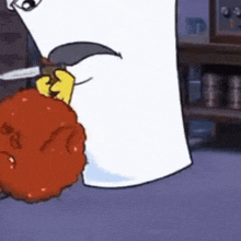 a cartoon character is holding a knife over a chicken nugget