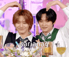 two men are making a heart shape with their hands and the word saria nag is visible in the corner