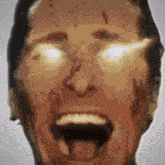 a close up of a man 's face with his mouth wide open