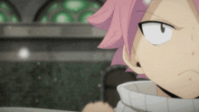 a close up of a person with pink hair and a white sweater