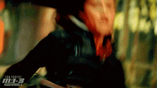a movie poster for mission impossible 3 shows a man being punched in the face