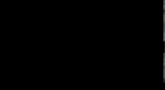 a group of people are standing in a dark room and one of them is wearing a shirt that says ' x '