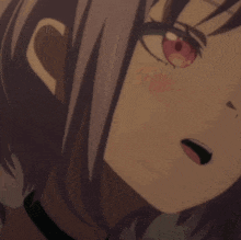 a close up of a girl with red eyes