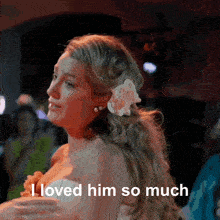 a woman in a wedding dress with a flower in her hair and the words i loved him so much