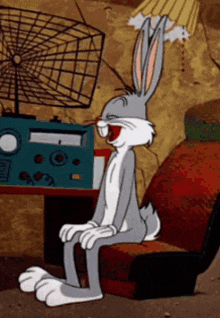 a cartoon of bugs bunny sitting in a chair with his mouth open