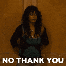 a woman is standing in front of a wall with the words no thank you on the bottom