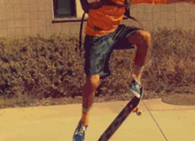 a person riding a skateboard on a sidewalk with a backpack
