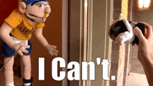 a puppet with a yellow shirt that says " i can 't "