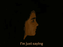 a close up of a girl 's face with the words `` i 'm just saying '' written on it .