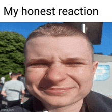 a close up of a man 's face with the words my honest reaction below it