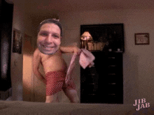 a man without a shirt is holding a towel in a room with jib jab written on the bottom